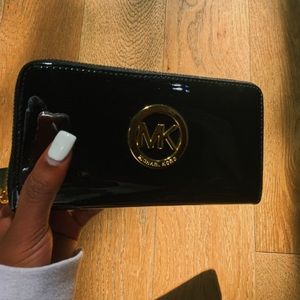 ★ A Michael kors wallet with gold lettering ★